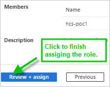 Screenshot with green arrow pointing to the Review + assign button at the bottom of the Review + assign tab.